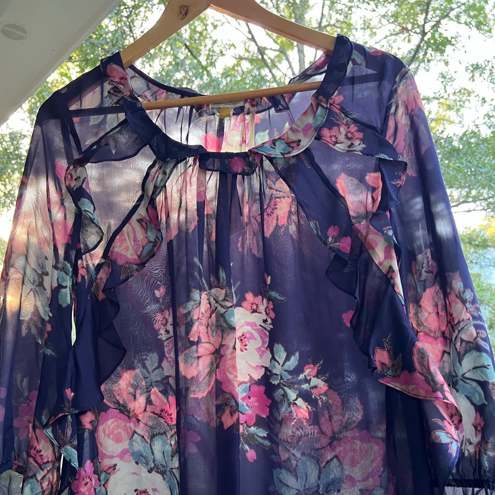 Long sleeve silk blouse, ruffles on neck and sleeve, airy and light.